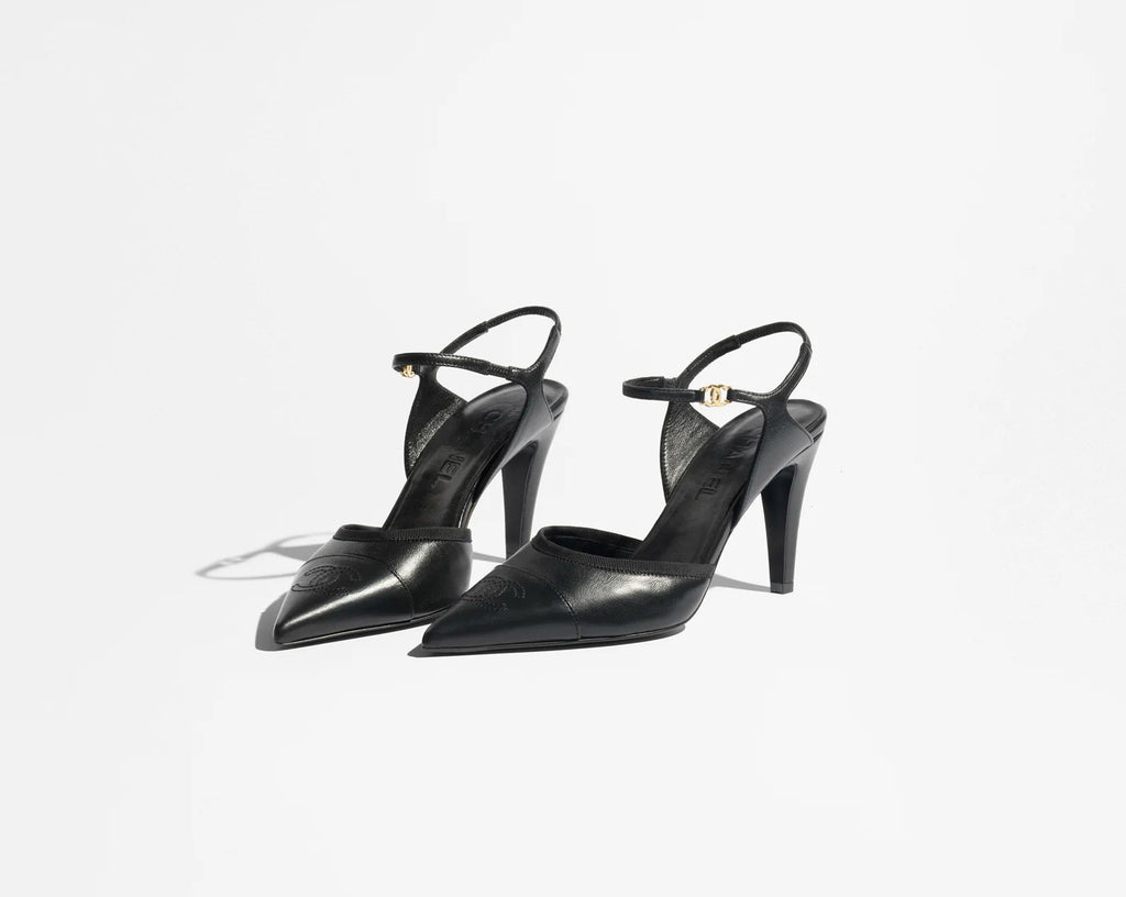 Black high-heeled shoes on a white background