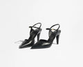 Black high-heeled shoes on a white background