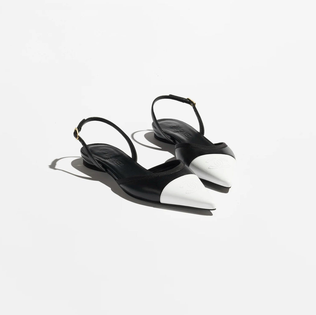 Black high-heeled sandals on a white background