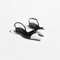 Black high-heeled sandals on a white background